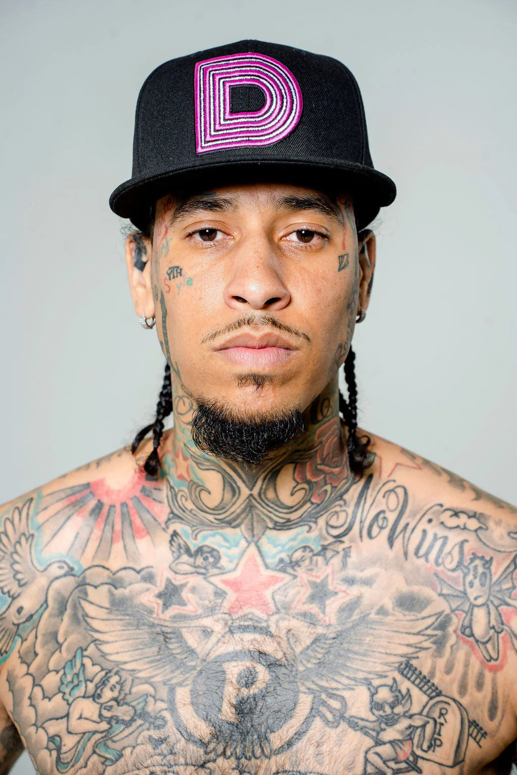 Product photo of a black fitted cap with a prominent D logo.